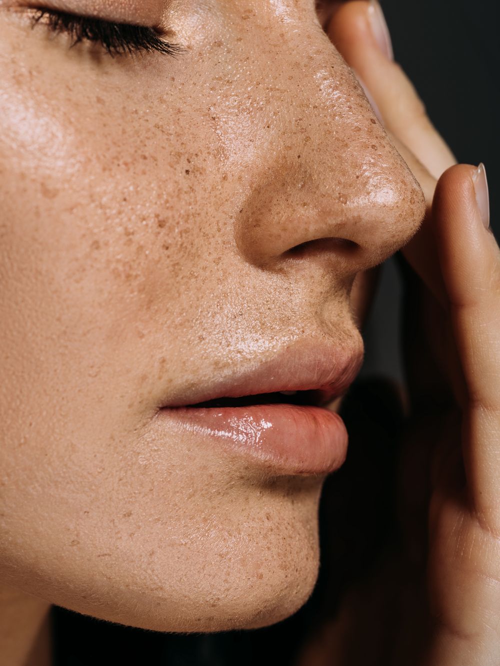 close up view of tender woman with freckles on face isolated on greybeautiful,person,girl,female,people,beauty,caucasian,wellbeing,f, beautiful, person, girl, female, people, beauty, caucasian, wellbeing, face, care, skin, tender, woman, lifestyle, feminine, skincare, purity, attractive, posing, wellness, carefree, tenderness, freckles, bodycare, naturel, close up, studio shot, young adult, natural beauty, isolated on grey