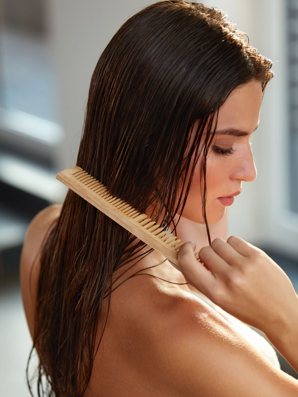 Hair Care. Closeup Of Beautiful Girl After Bath Hairbrushing Healthy Straight Brown Hair. Young Woman Brushing Her Long Wet Hair With Wooden Comb. Health And Beauty Concept. High Resolution ImageIhor Pukhnatyyhair, comb, combing, haircombing, brush, brushing, hairbrush, hairbrushing, care, haircare, health, healthy, healthcare, hand, hands, wet, long, beauty, beautiful, brunette, hairstyle, woman, female, model, styling, treatment, vitamins, closeup, close-up, portrait, sexy, young, concept, wooden, face, high, resolution, image