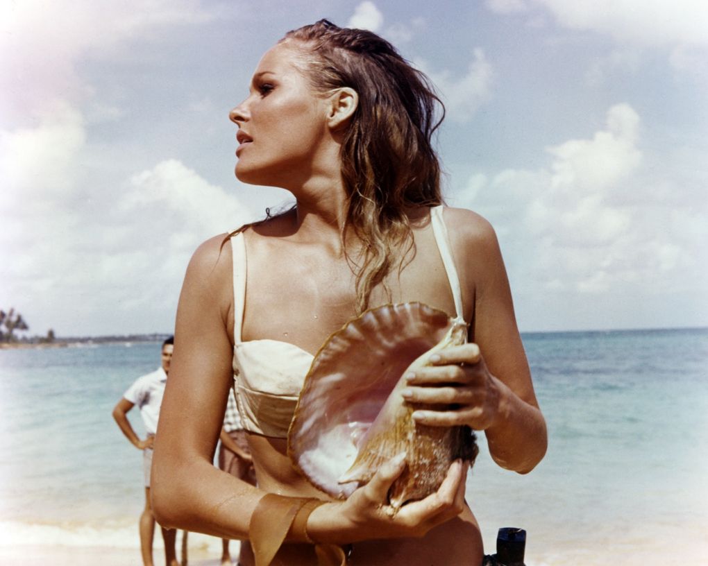 actress, wearing a white bikini and holding a conch shell in a publicity still issued for the film, \'Dr No\', 1962 