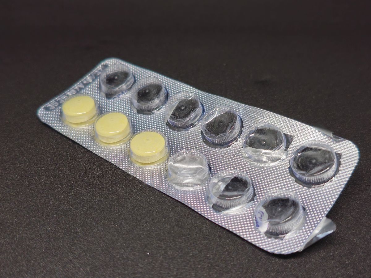 Empty medicine blister packs don't belong in yellow plastic container