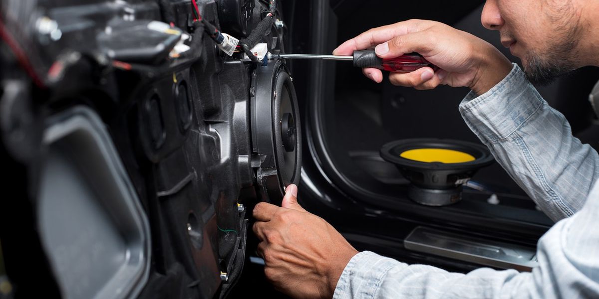 Technician installing the car speaker to the car door. Car audio installation concept.Mr.Norasit Kaewsaisound, system, audio, entertainment, stereo, speakers, bass, subwoofer, loud, music, song, electronics, voice, treble, tweeter, relaxation, leisure, woofer, hobby, round, musical, vibration, loudspeaker, equipment, circle, electronic, multimedia, audiophile, volume, acoustic, technology, midrange, midbass, car speaker, door, vehicle, install, setup, car, technician, people, man, male, coaxial, 2-way, 3-way, door panel