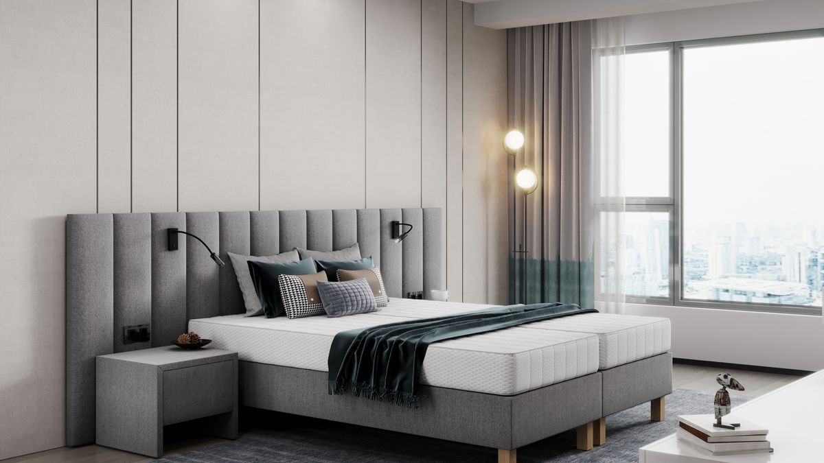 Łóżko w apartamencie premium.