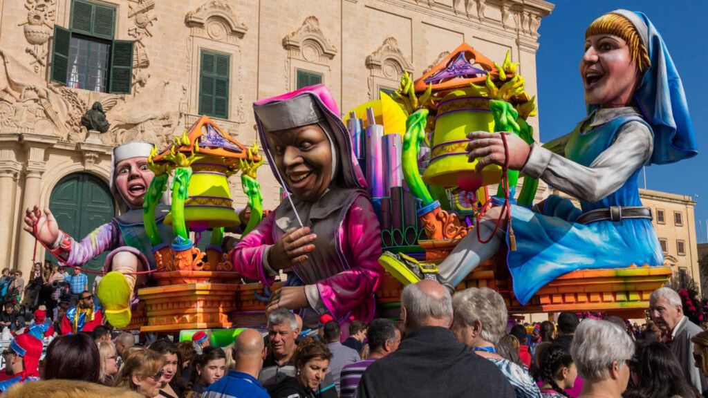 Highly,Colourful,Paper,Mache,Floats,Fill,The,Streets,Of,Valletta
dress,capital,fancy,color,church,float,med,platform,scene,folklo