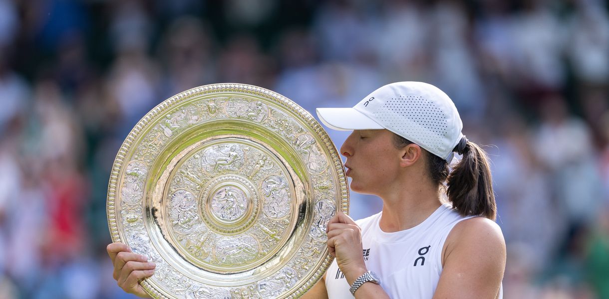 LONDON, ENGLAND - JULY 12: Iga Swiatek of Poland with the winners trophy after beating Amanda Anisimova of the USA (not pictured) in Women's Singles Final at The Wimbledon Lawn Tennis Championship at the All England Lawn and Tennis Club at Wimbledon on July 12th, 2025 in London, England. (Photo by Simon Bruty/Anychance/Getty Images)