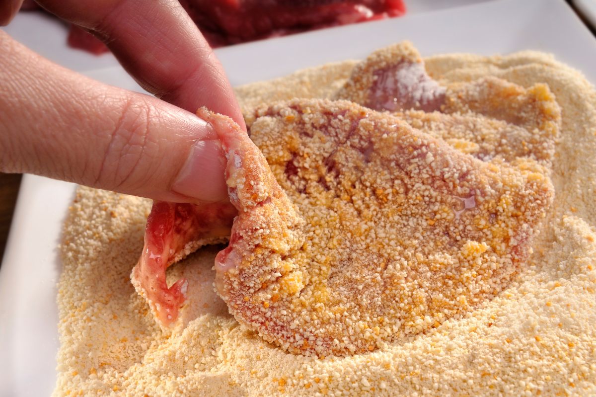 a piece of meat covered in flour and seasonings