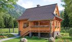 Projekt domu L-74 Dom miejska - z bali - parterowy z poddaszem dom o powierzchni 52 m², dach dwuspadowy, koszt budowy 145 600 zł - ujęcie frontu