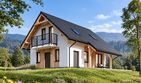 Projekt domu L-304 murowany - parterowy z poddaszem dom o powierzchni 73,82 m², dach dwuspadowy, koszt budowy 186 000 zł - ujęcie frontu