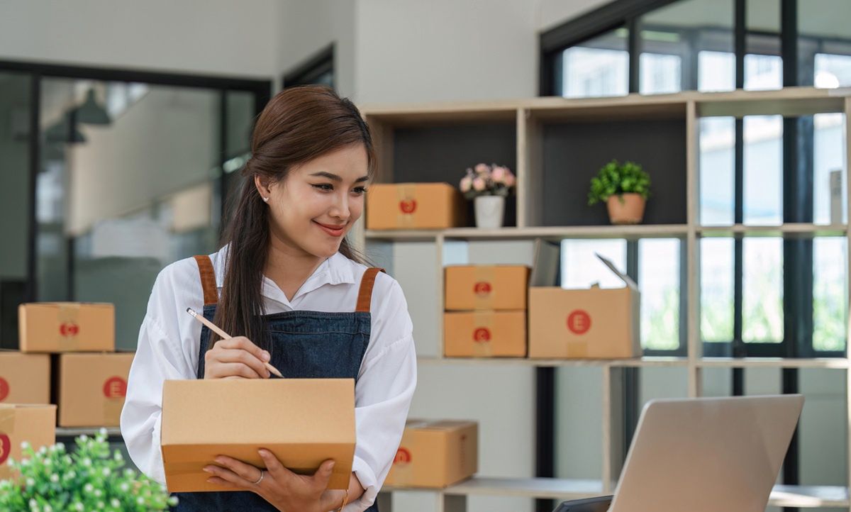 Business From Home Asian woman preparing package delivery box Shipping for shopping online. young start up small business owner at home online orderBusiness From Home Asian woman preparing package delivery box Shipping for shopping online. young start up small business owner at home online order.entrepreneur, success, selling, online, order, delivery, retail, package, parcel, marketing, shipping, logistic, office, person, businesswoman, internet, work, owner, computer, merchant, sell, indoor, happy, female, laptop, home, business, cyberspace, technology, online shopping, woman, young, digital, girl, house, seller, shopping, lifestyle, sale, startup, store, product, small, shop, box, asian, phone, e-business, smartphone, freelance