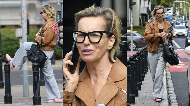 Znudzona Paulina Smaszcz z torebką za 15 tysięcy złotych wyżywa się na słupku miejskim w oczekiwaniu na taksówkę