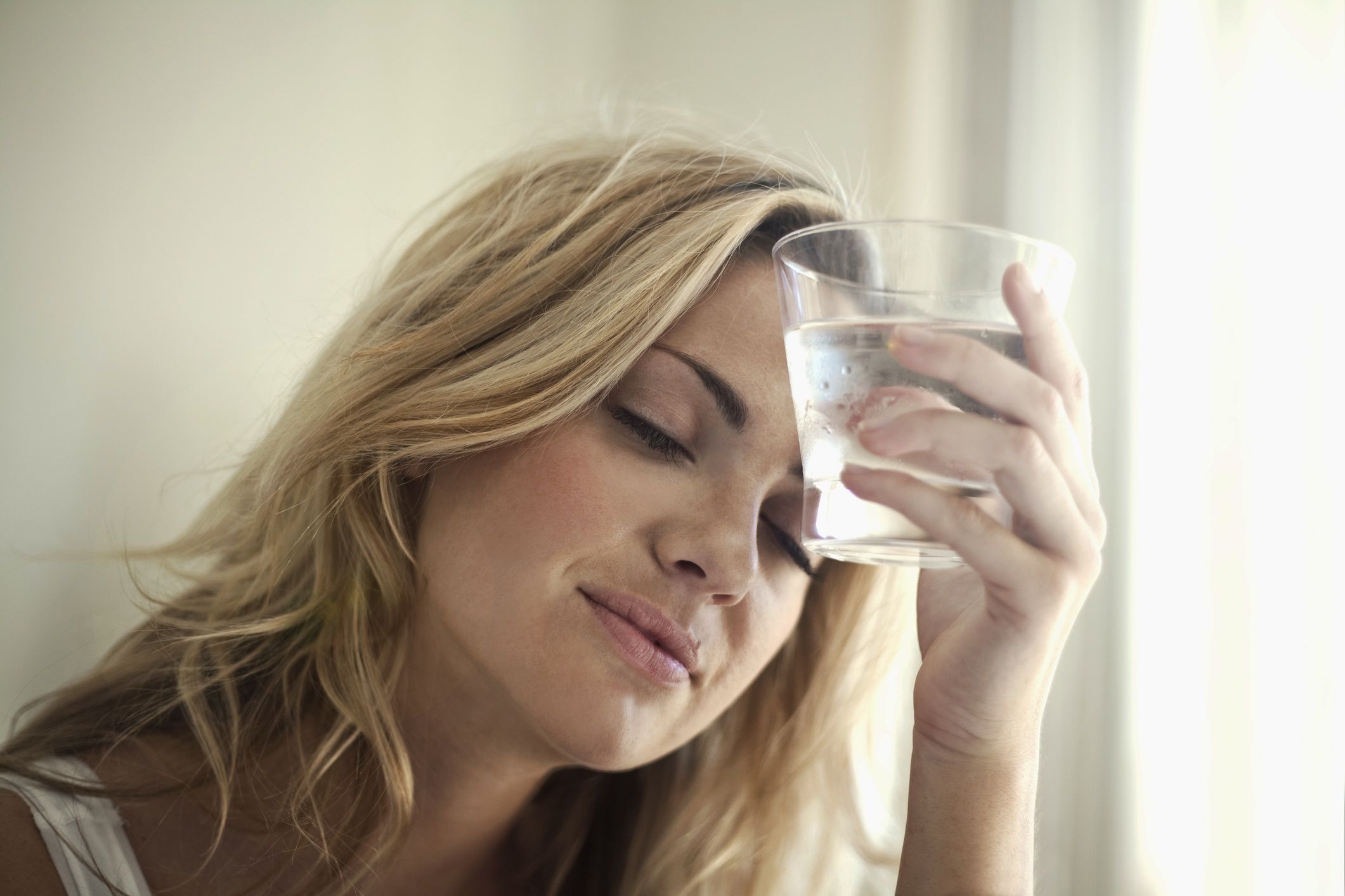 Young woman holding glass of water against her forehead at home
Westend61
20-30 years, adults, attractive, blond, caucasian, dishes, face, glass, home, migraine, millennials, sunshine, woman, young adults