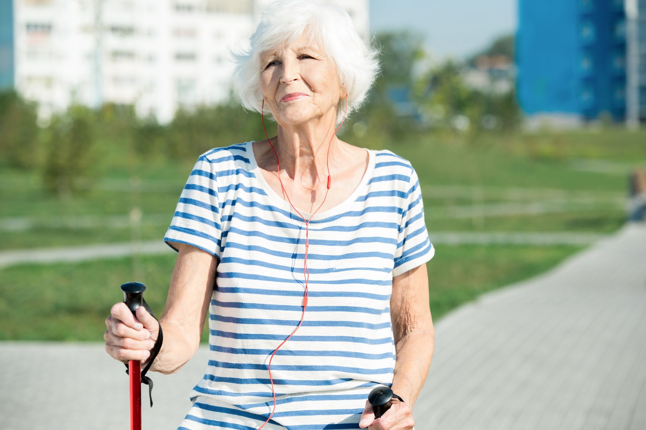 Modern Senor Woman Enjoying Nordic Walking
Waist up portrait of modern senior woman enjoying Nordic walking with poles in park and smiling while listening to music, copy space, sunlight,
SeventyFour