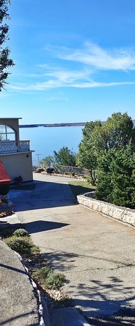 Apartment Jela-on the seafront Tribanj