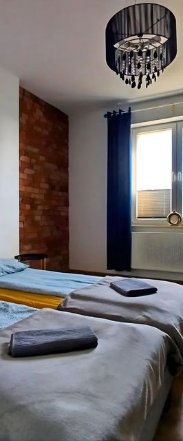 Przestronny Apartament z Trzema Sypialniami Centrum Torunia