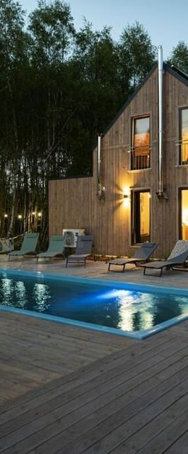 Między Brzozami / Domy w lesie