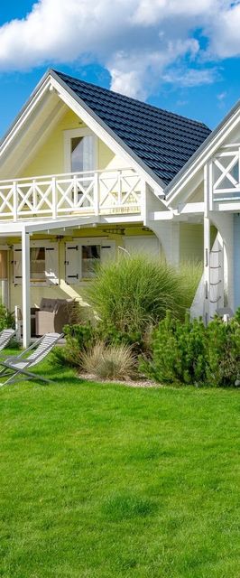 Domki nad morzem Otulone Słońcem Rowy