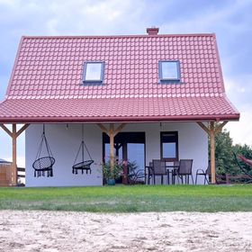 Domki nad jeziorem z banią i jacuzzi