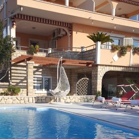 Apartmanok és Szobák Medencével Novalja, Pag - 9334 Novalja