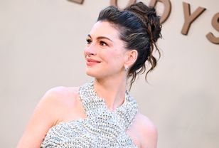 Anne Hathaway wears Prada at "Odyssey" premiere