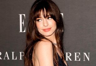 Pregnant Anne Hathaway stuns in ivory silk gown at Late Night with Seth Meyers