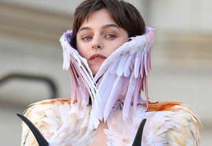 Emma Corrin stuns in feathered Schiaparelli look at Paris Haute Couture Week
