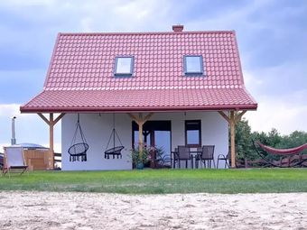 Domki nad jeziorem z banią i jacuzzi