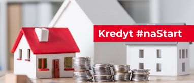 kredyt na start stosy monety na tle małych modeli domów
