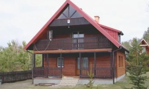 Domek z własnym pomostem nad jeziorem Marksewo