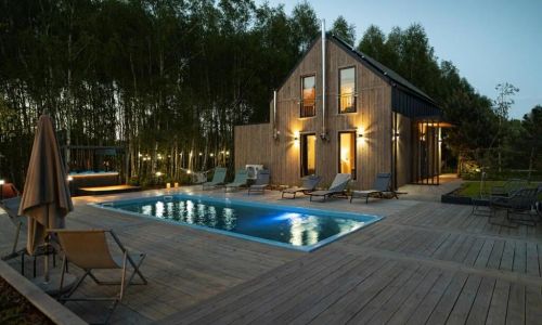 Między Brzozami / Domy w lesie