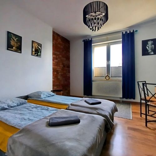 Przestronny Apartament z Trzema Sypialniami Centrum Torunia