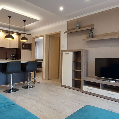 Apartament la parter cu vedere spre grădină cu 2 camere pentru 4 pers.
