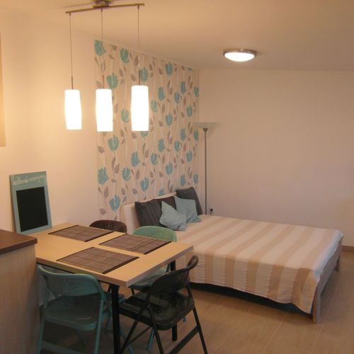 Apartament 4-osobowy z tarasem z widokiem na ogród