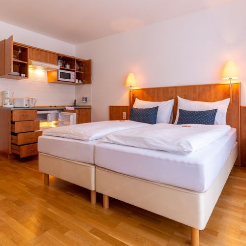 Apartament 2-osobowy z balkonem z własną kuchnią z 1 pomieszczeniem sypialnianym
