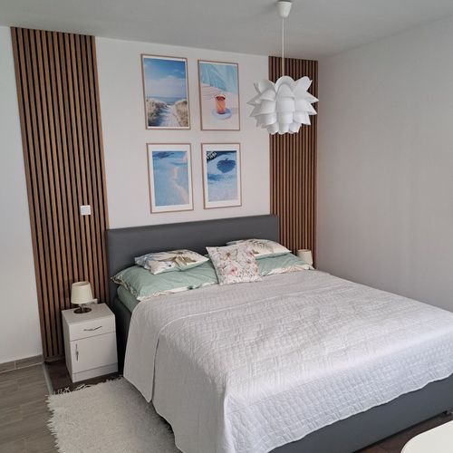 Apartament 2-osobowy na parterze z dostępem do ogrodu z 1 pomieszczeniem sypialnianym (możliwa dostawka)