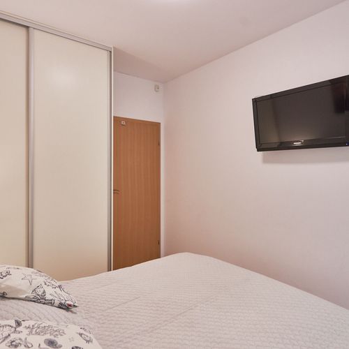 Apartament 4-osobowy na parterze z balkonem z 2 pomieszczeniami sypialnianymi