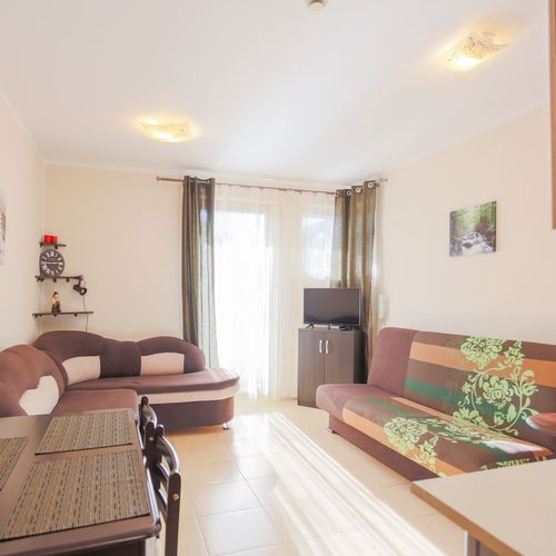 Apartament 4-osobowy na parterze z balkonem z 1 pomieszczeniem sypialnianym