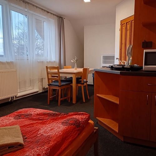 Apartament 5-osobowy z balkonem z aneksem kuchennym z 2 pomieszczeniami sypialnianymi