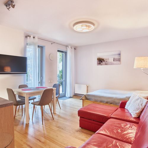 Apartament 4-osobowy na parterze z balkonem z 1 pomieszczeniem sypialnianym