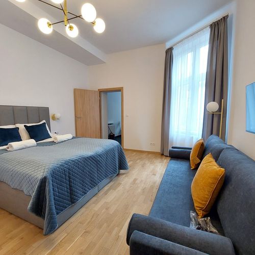 Apartament 4-osobowy z balkonem z własną kuchnią z 1 pomieszczeniem sypialnianym