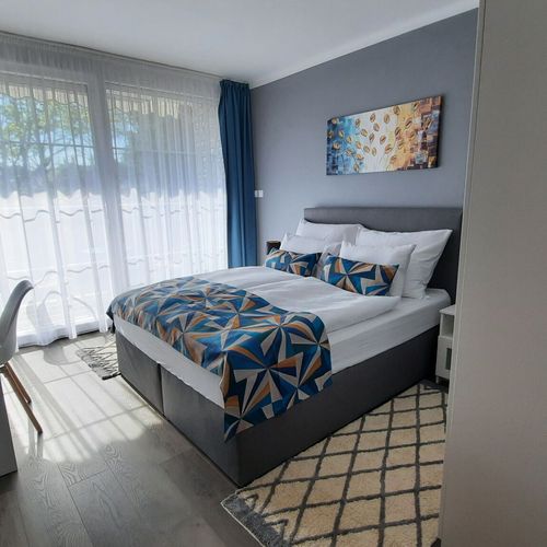 Apartament 4-osobowy na parterze z dostępem do ogrodu z 2 pomieszczeniami sypialnianymi