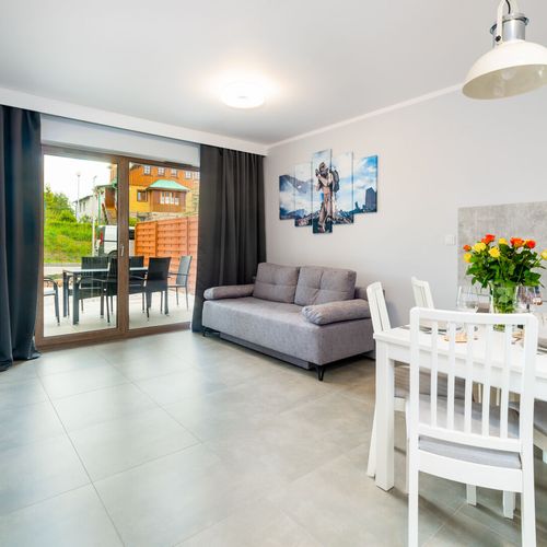 Apartament 6-osobowy z tarasem z dostępem do ogrodu z 2 pomieszczeniami sypialnianymi