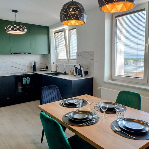 Apartament 4-osobowy z balkonem z 2 pomieszczeniami sypialnianymi