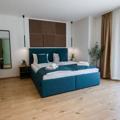 Apartament 2-osobowy na parterze z tarasem z 1 pomieszczeniem sypialnianym (możliwa dostawka)
