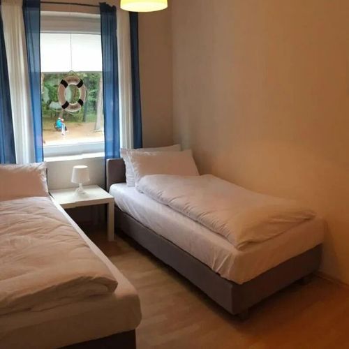 Apartament 4-osobowy z balkonem z 2 pomieszczeniami sypialnianymi