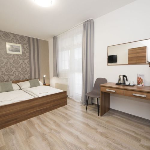 Apartament familial(ă) cu duș cu 2 camere pentru 4 pers. (se poate solicita pat suplimentar)