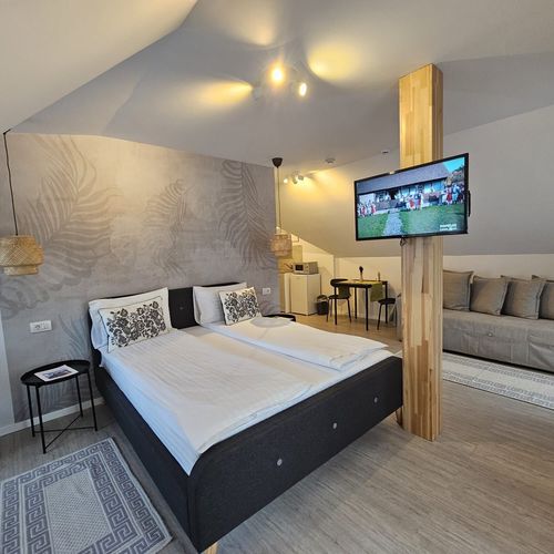 Apartament la mansardă cu chicinetă proprie cu 1 camera pentru 4 pers.
