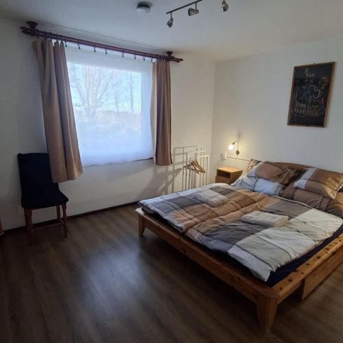 Apartament 6-osobowy na parterze z widokiem na ogród z 2 pomieszczeniami sypialnianymi (możliwa dostawka)