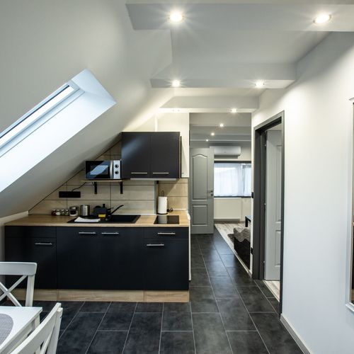 Apartament 4-osobowy na poddaszu z widokiem na jezioro z 2 pomieszczeniami sypialnianymi