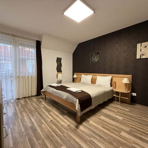 Apartament la etaj cu vedere spre grădină cu 1 camera pentru 4 pers.