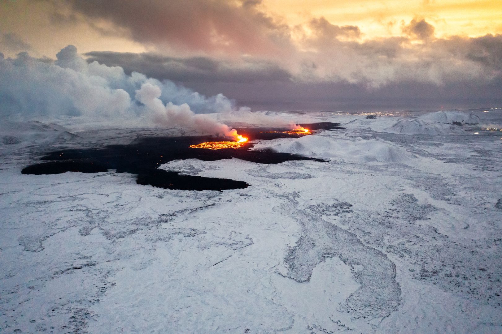 Drone captures the real clash of lava and snow in Iceland