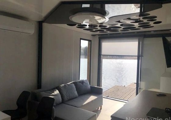 Domki pływające na Jeziorze Smarzewskim Rakowiec